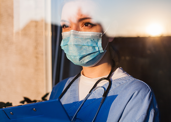 Nurse looking out window